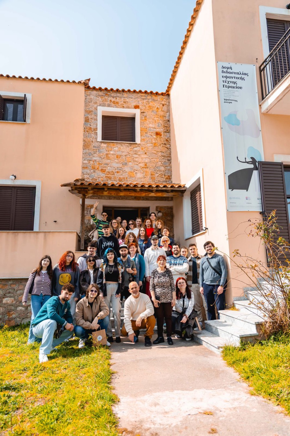 Group photo of all the participants outside the Geraki Weaving School